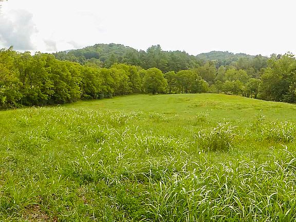 atop knoll in corner of lot