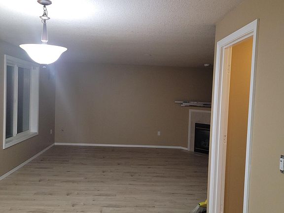 Newly installed Vinyl plank flooring throughout family room, kitchen, dining, living, and laundry room.