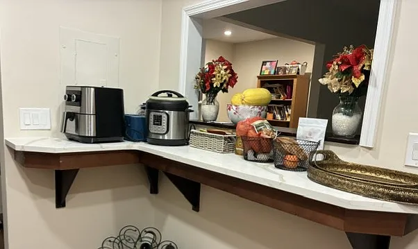 Breakfast bar or counter space. Opens to the separate dining room.