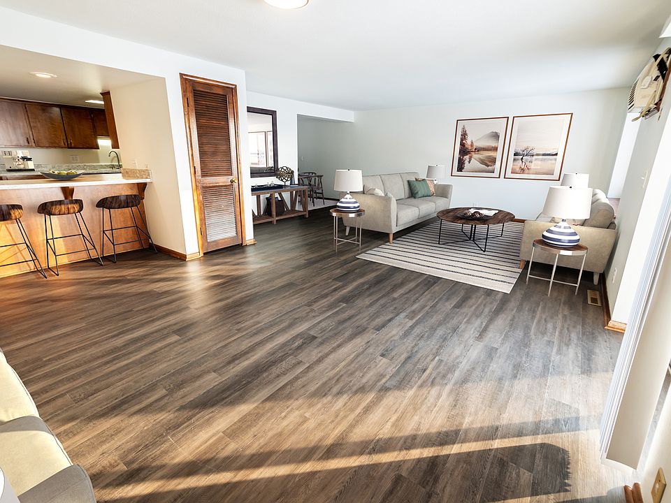 Welcome to Central Lakes of Uptown, where contemporary design meets comfort. This spacious living area features stunning floors and abundant natural light, perfect for relaxation and entertaining. Explore your new home today!