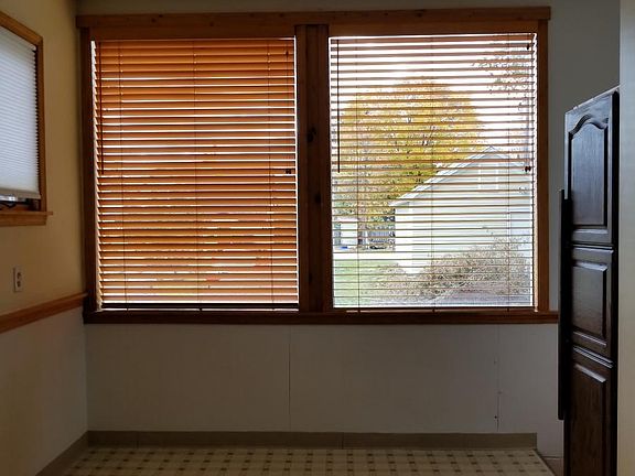 picture window in the kitchen with new window treatments