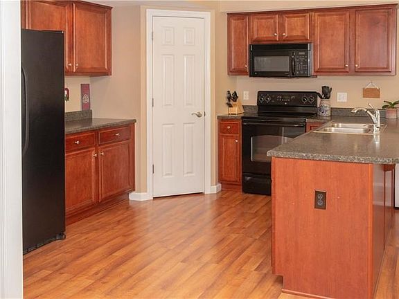 The kitchen includes appliances and is spacious with plenty of counter space.