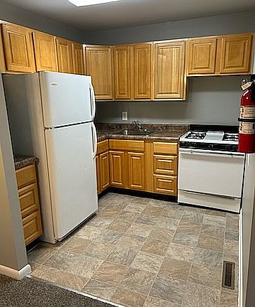 Step into a well-equipped kitchen that's perfect for home-cooked meals and gatherings.