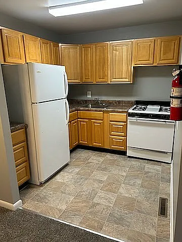 Step into a well-equipped kitchen that's perfect for home-cooked meals and gatherings.