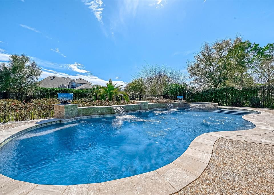 Let the summer fun begin in this inviting pool and spa!