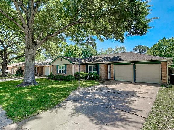 Another view with the gorgeous mature tree and shrubbery right out front.