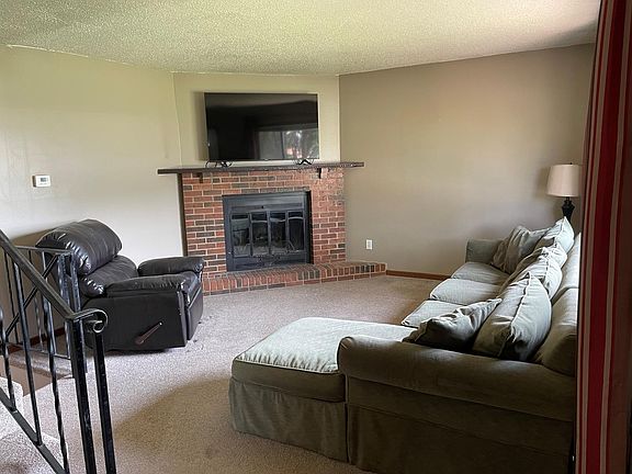 Living room with wood-burning fireplace
