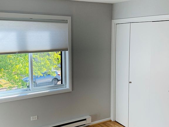 One of two bedrooms with a big closet, and ceiling designer Minke ceiling fan. Simple, bright and clean. Large closet and nice floors.