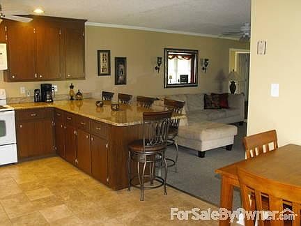 Open floor plan
						:
						Eat-in kitchen, breakfast nook or large bar. Viewfireplace & screened-in porch.