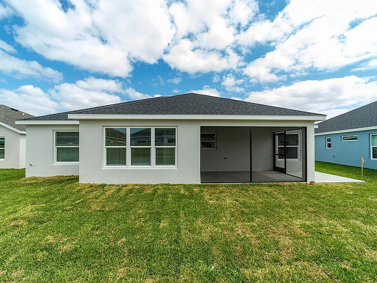 Spacious lanai with full backyard views_perfect for entertaining.