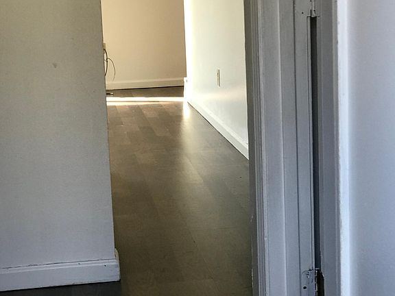 Entering thru front door. First door on R is half bath. Continue with laundry on R and coat closet on L. Kitchen is on R across from bathroom just before coat closet.