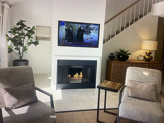Living room with Fireplace and TV viewing