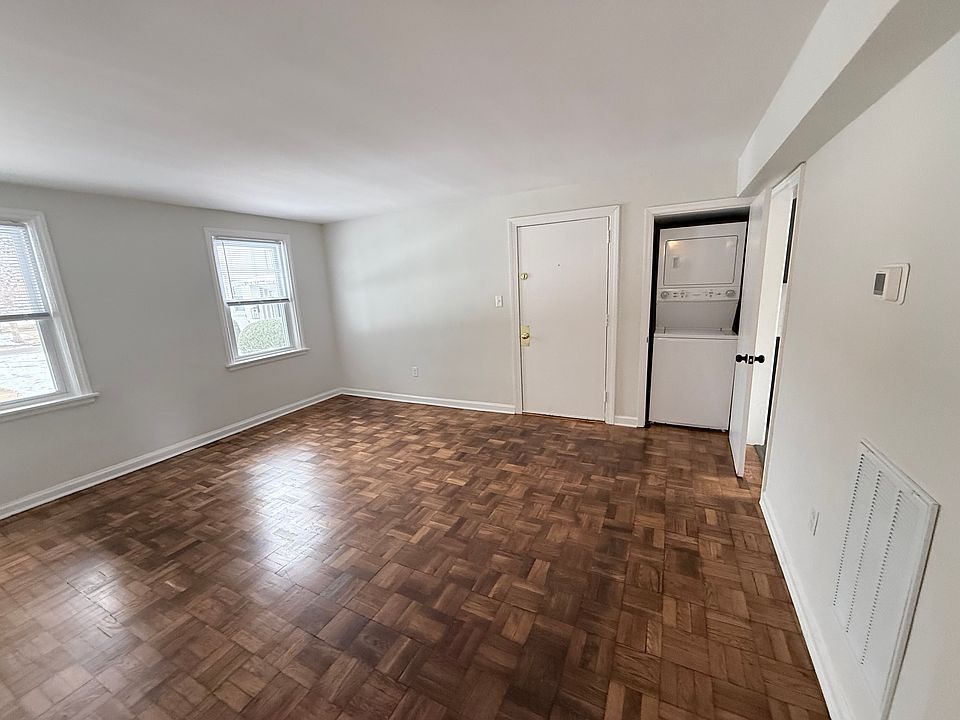Living Room view & in unit Stack washer & dryer