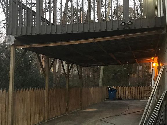 covered under deck, more parking