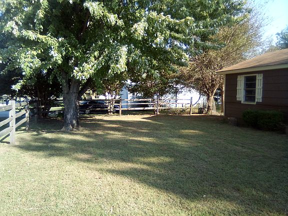 3-rail timber fence in frontyard