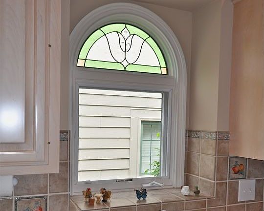 Lead stained glass window above Kitchen sink