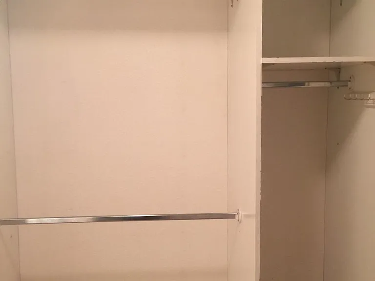 One Side of Master Bedroom Closet