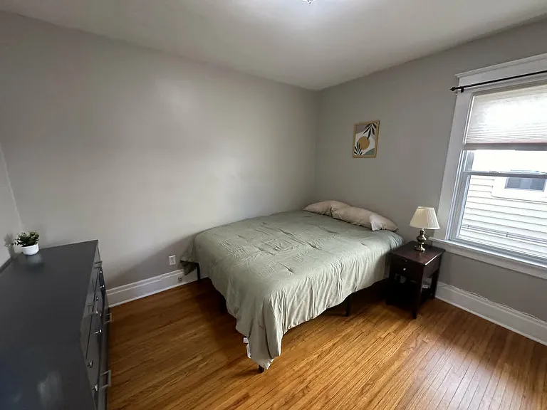 Comfortable second bedroom with plenty of space for relaxing and storage.