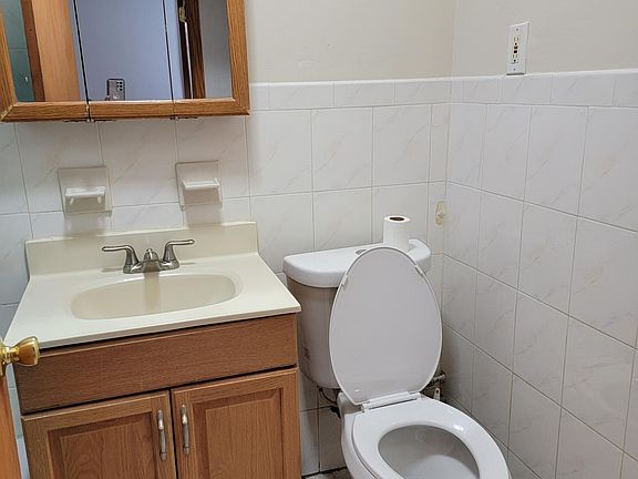Bathroom and bathtub is on the left side
