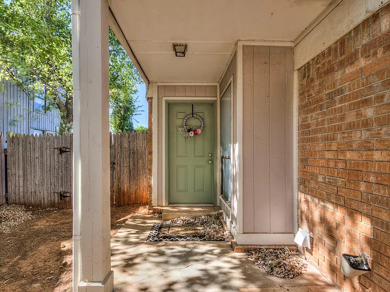 Front door with gate access to the backyard