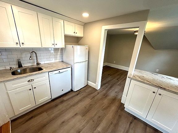 Shaker White Cabinetry with Brushed Nickel Hardware.