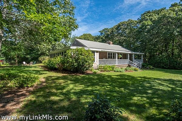 Located on a private,  beautifully landscaped, 1/2 acre yard