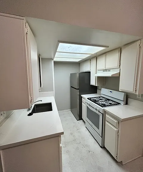 New refrigerator, newer gas range, newer countertops