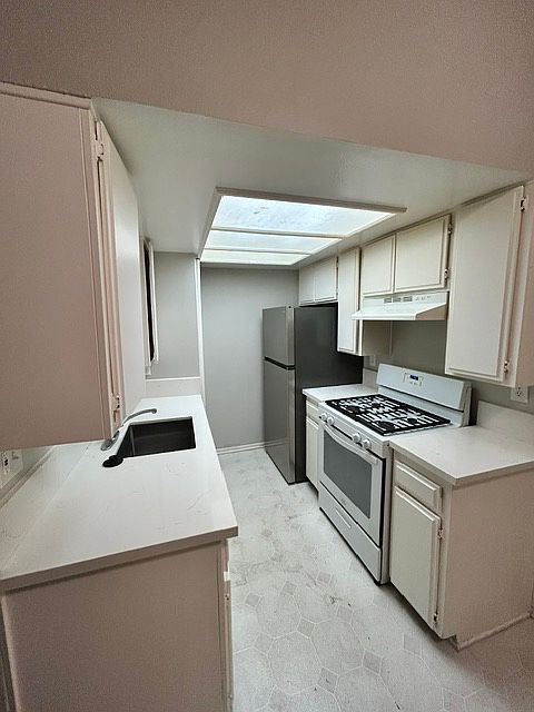 New refrigerator, newer gas range, newer countertops