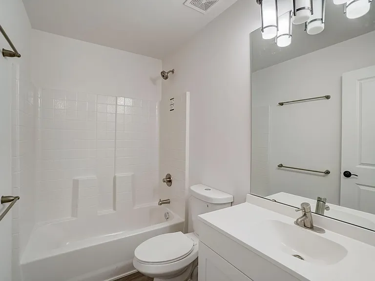 full bath with tiled look prefab walls so no grout or caulk maintenance issues