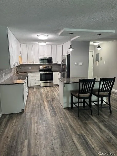 Building Photo - 3082 S Wheeling Way #211