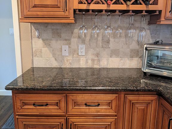 Kitchen with granite countertops - wine rack