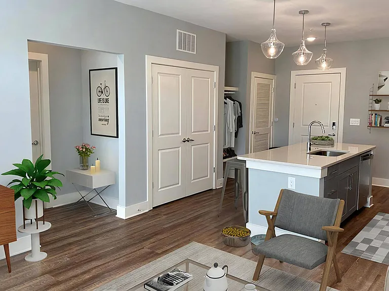 Open-Layout Apartment with Kitchen Island, Ample Storage, and Designer Finishes