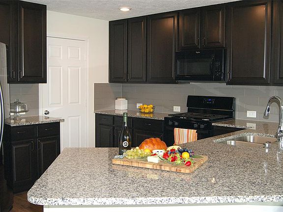 Spacious kitchen open to dining and living