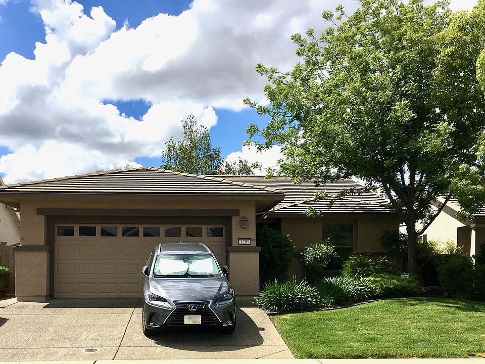 Curb Appeal with plenty of shade and manicured yard