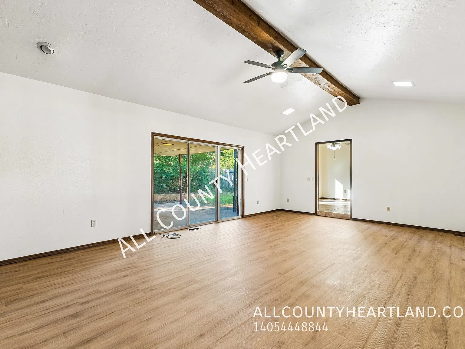 Spacious 4-Bedroom Home with Stone Fireplace, Updated Flooring & Covered Patio! — Photo 4