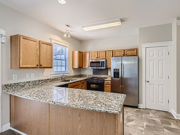 Kitchen has granite counters. Pantry closet.