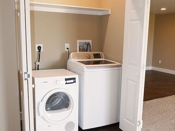 Laundry space includes brand new ventless dryer and large washer