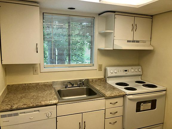 Kitchen with lots of cabinet space, garbage disposal, and dishwasher.
