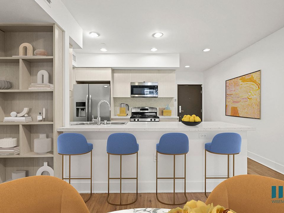 Open-Conecpt Kitchen with Countertop Bar, and Built-In Bookshelf