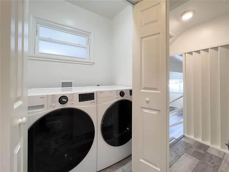 Laundry room in between front bedroom and living room