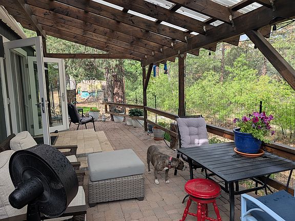 larger covered porch on creek side of house