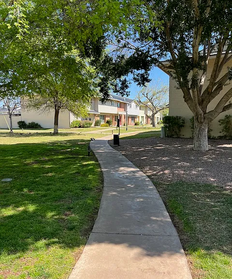 Eastwood Townhomes Community Common Area Walkways, Large Grass & Trees Common Area directly adjacent to this listed for rent Eastwood Townhomes Premises Rental Unit.