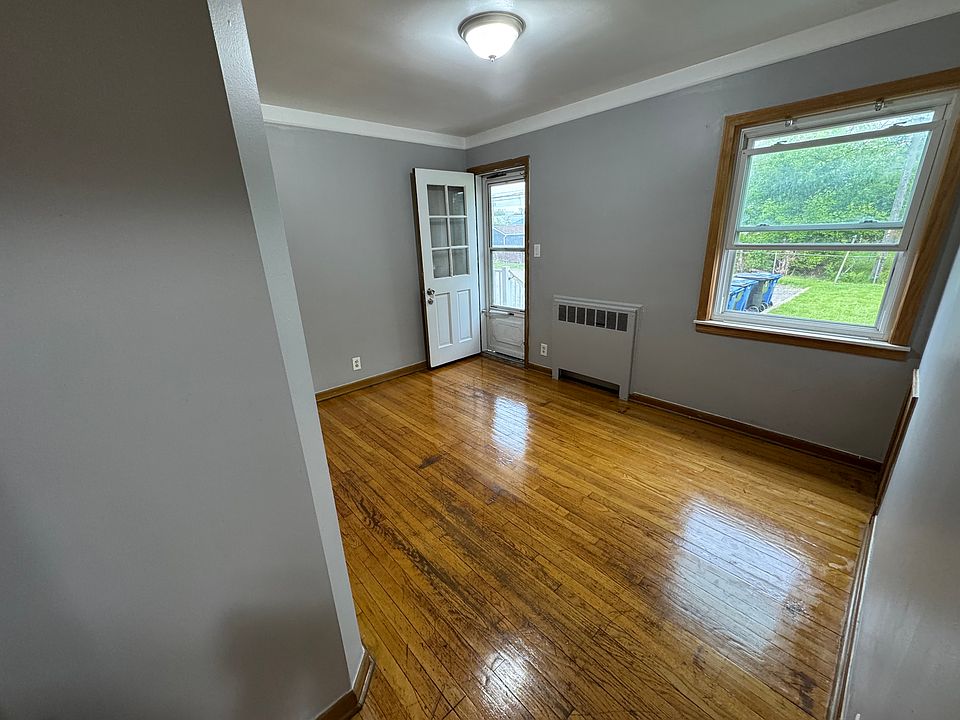 Bedroom 1 with entry/exit into parking lot.
