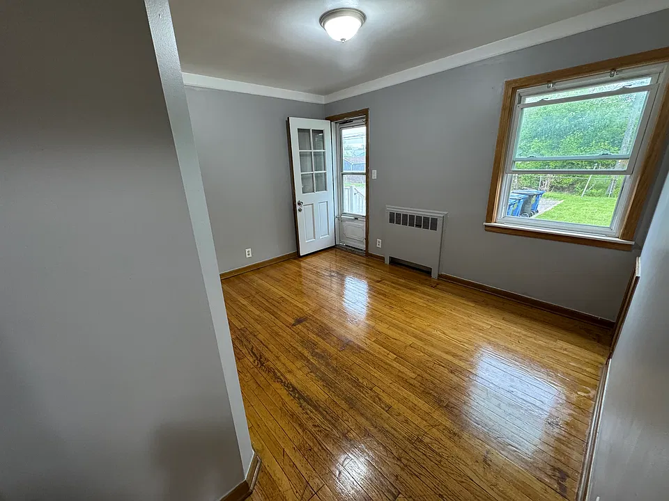 Bedroom 1 with entry/exit into parking lot.