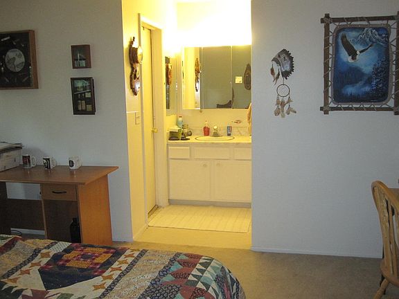 Jack and Jill style bathroom on upper level