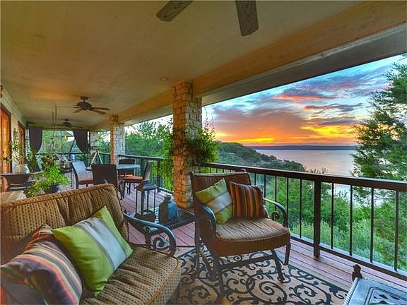 Enormous porches run the length of the home on both the upper and lower level, offering a birds eye 