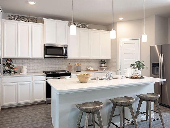 Cook meals as a family in your spacious kitchen.
