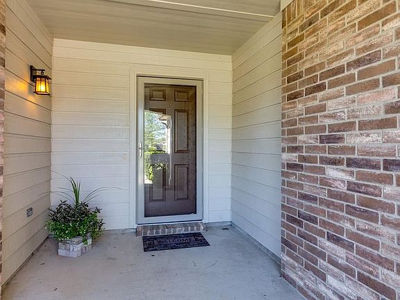 Large covered porch for a welcome entry