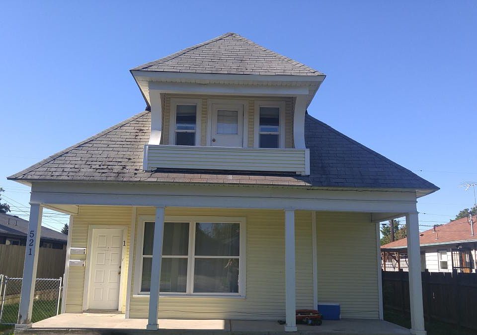 Front of house. Unit 2 balcony in view