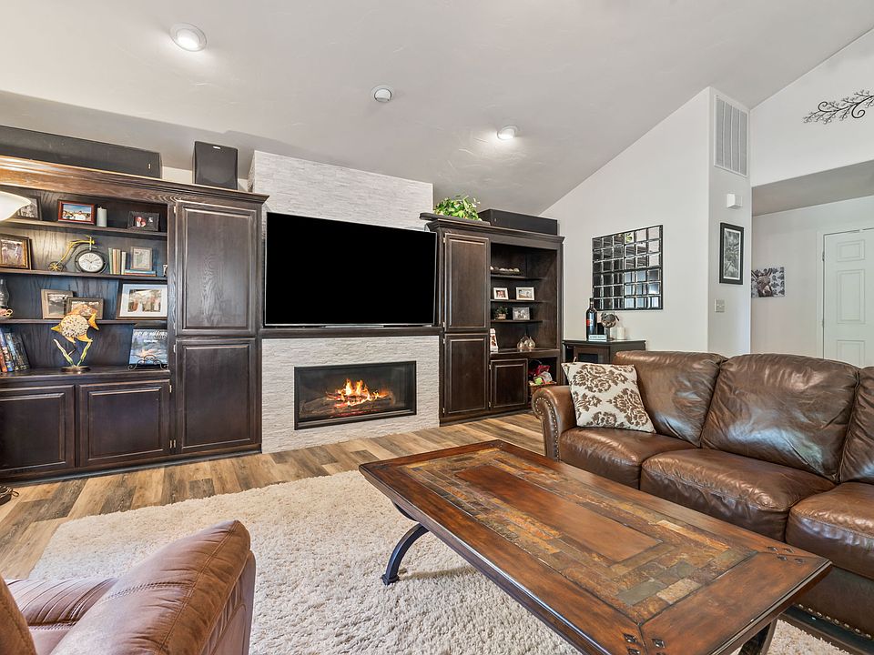 Gas fireplace. Built-in bookshelves and large screen T.V.